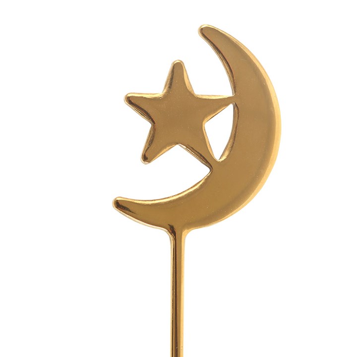 
                  
                    Star and Moon teaspoons laid out
                  
                